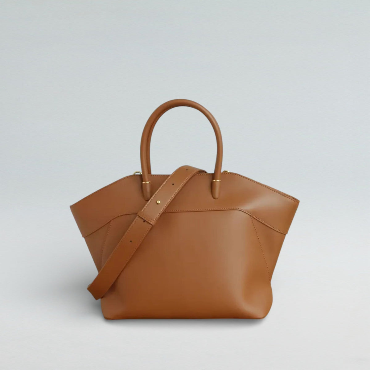 Lady Madonna zipper handbag showing polished hardware and structured leather body