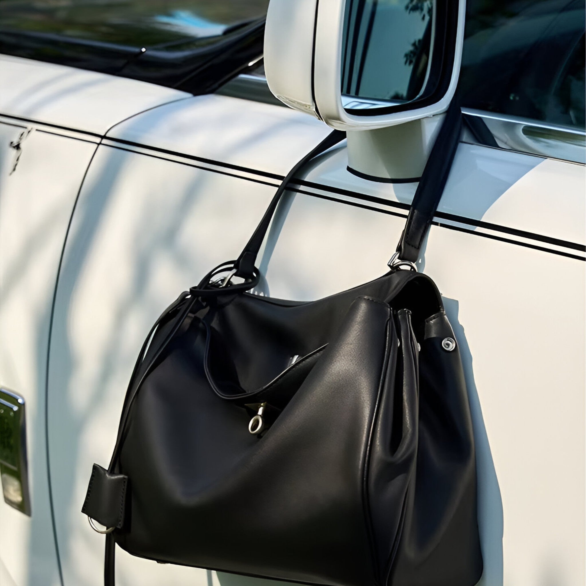 Louve-Locket-Black-Handbag-Hanging-On-Car-Mirror-By-Bagulia.jpg