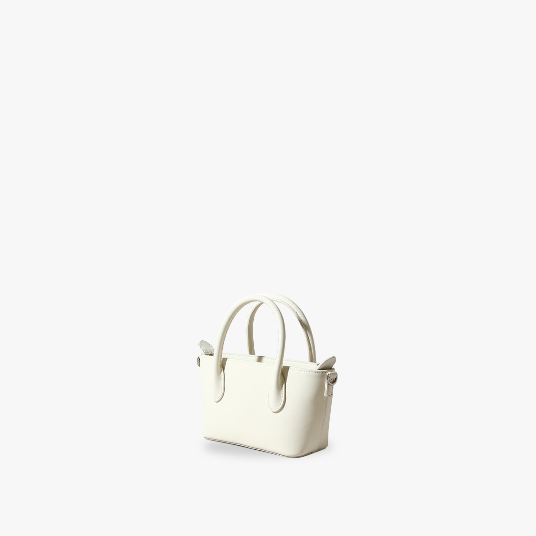 Elegant white mini tote handbag made from real full grain leather, perfect blend of luxury and chic style.