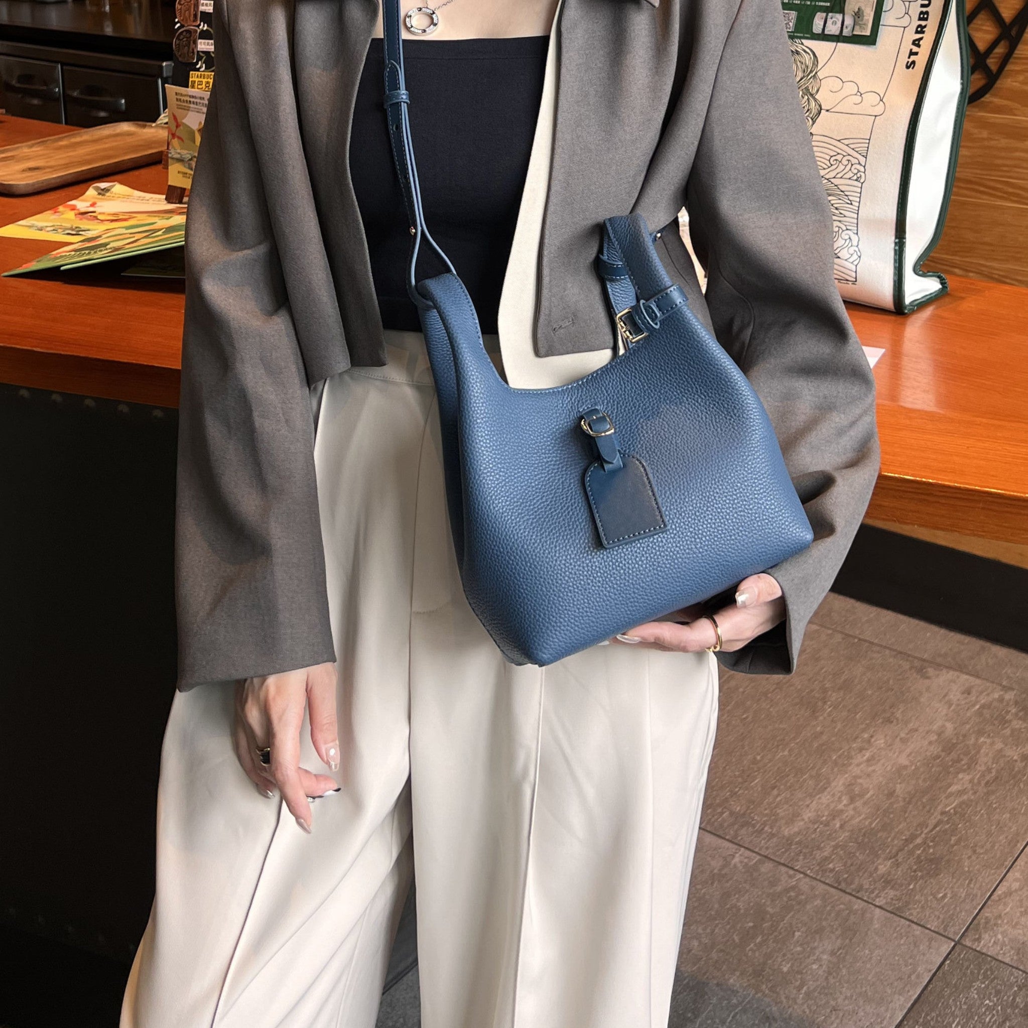 Model-Carrying-Muted-Blue-Lamia-Pebbeled-Top-Grain-Leather-Shoulder-Bag-Bagulia_22.jpg