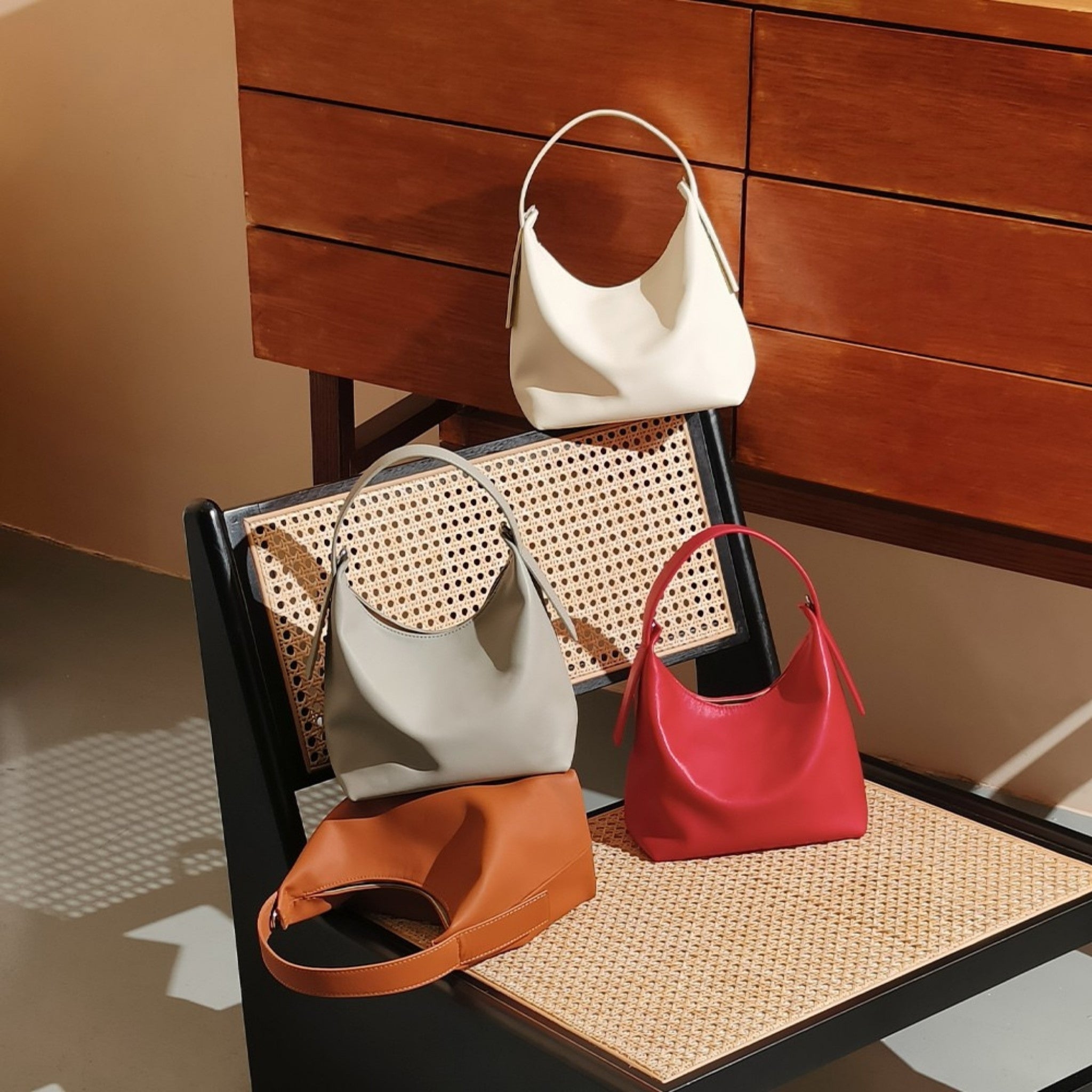 Slavia-Smooth-Top-Grain-Handbag-All-Colors-Bagulia-On-A-Chair.jpg