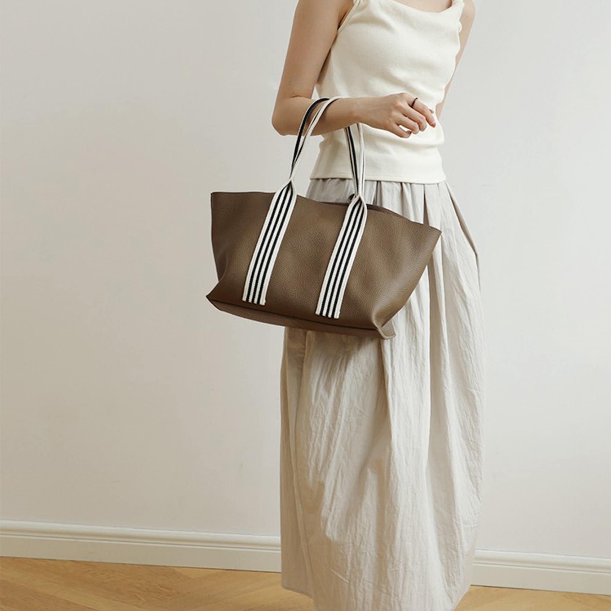 Wings-Sandstone-Pebbled-Leather-Tote-Handbag-Model-White-Dress-Bagulia.jpg