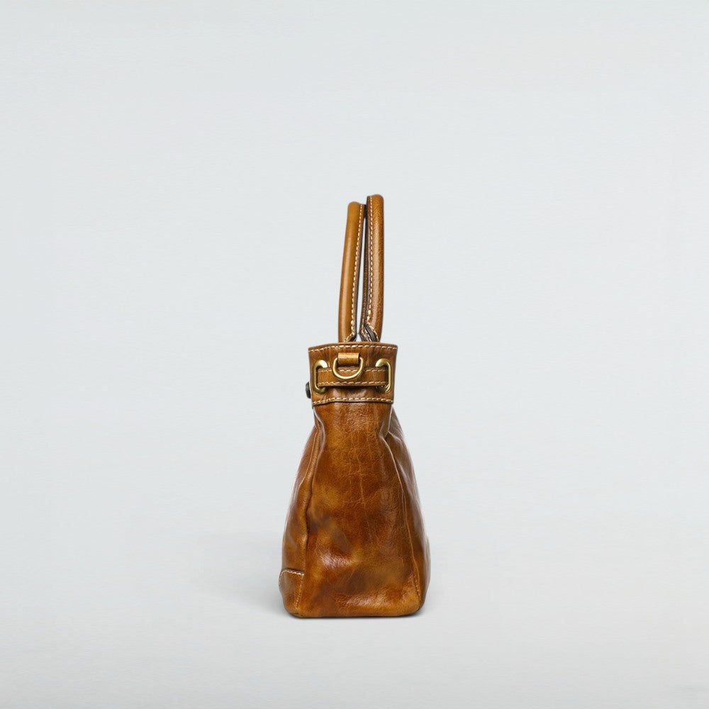 Side profile of the Bagulia Petra Glossy Leather Tote Bag in Caramel