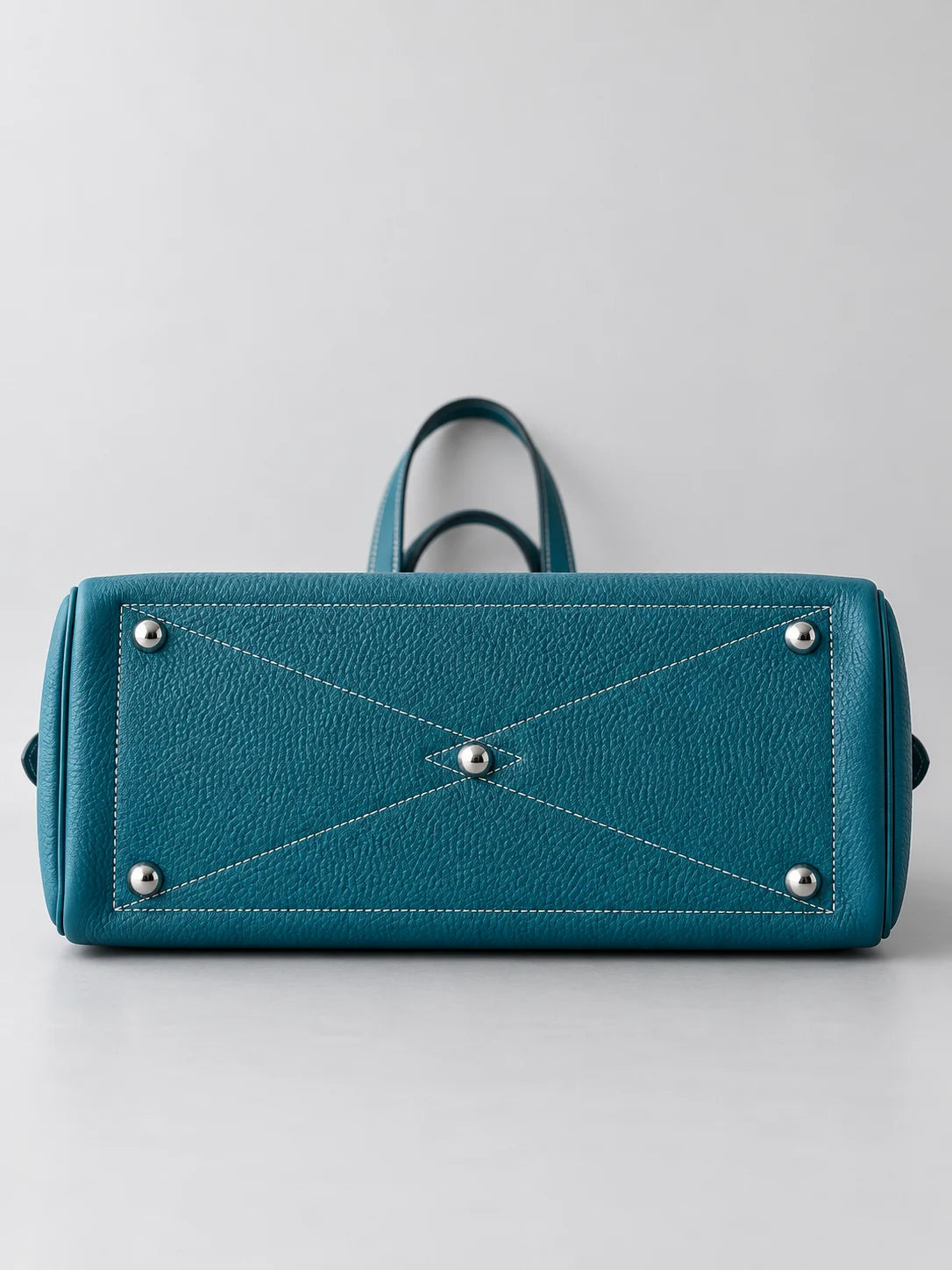 Ballerina leather tote in Dark Cyan, base with five metal feet