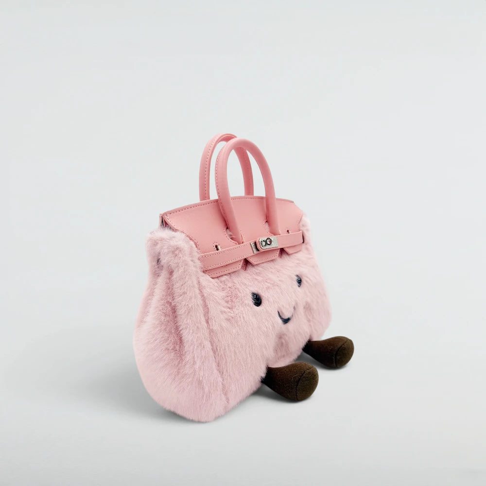 Bagulia Birky Baby Pink plush bag with pink leather flap and lashes detail, three-quarter angle view