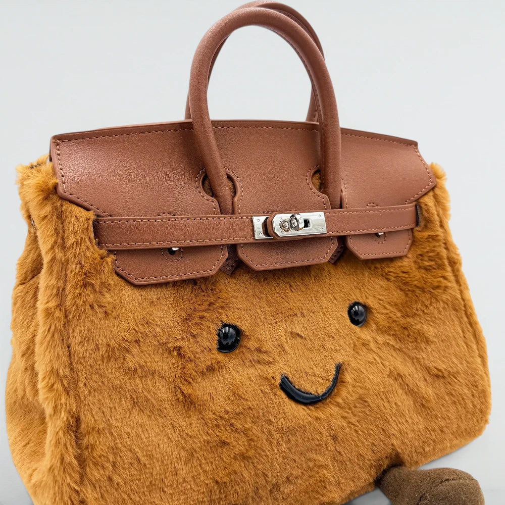 Close-up of the leather flap and silver lock on the Bagulia Birky Caramel plushy fur bag