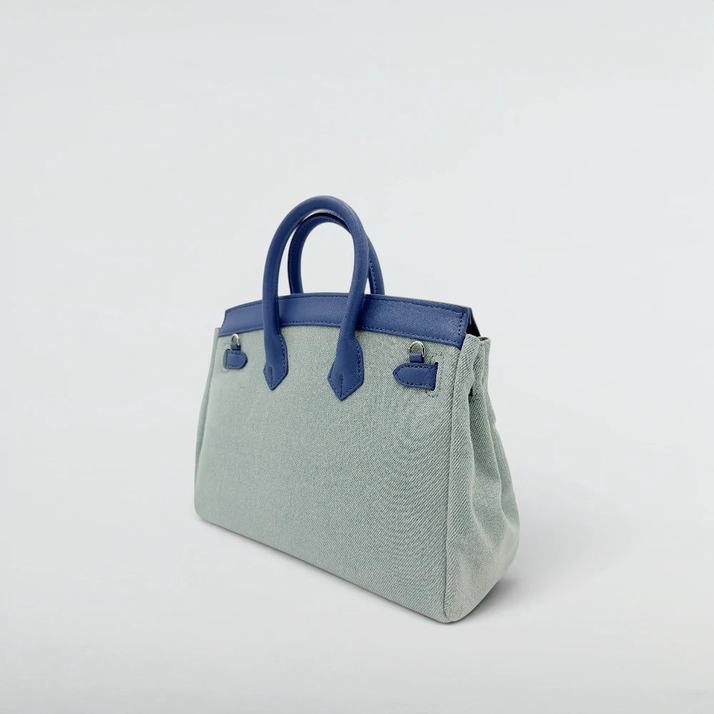 Back view of the Bagulia Birky 25cm Denim canvas handbag with blue leather handles