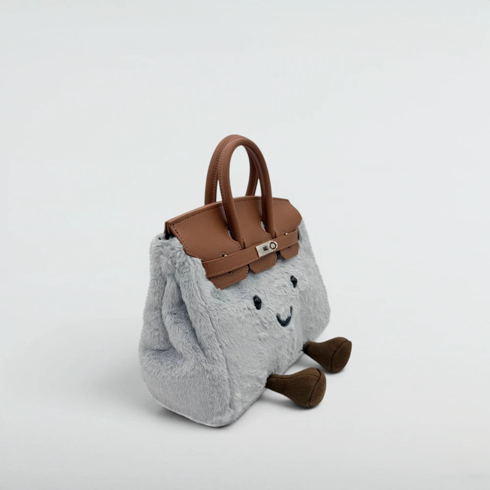 Bagulia Birky Grey plush handbag with tan leather flap, three-quarter angle view