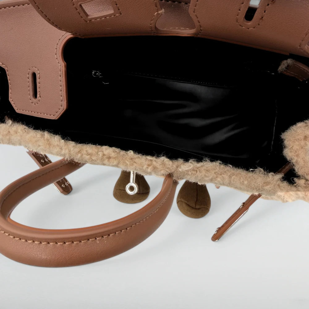 Inside view of the Bagulia Birky Light Khaki bag showing black lining and tan leather flap