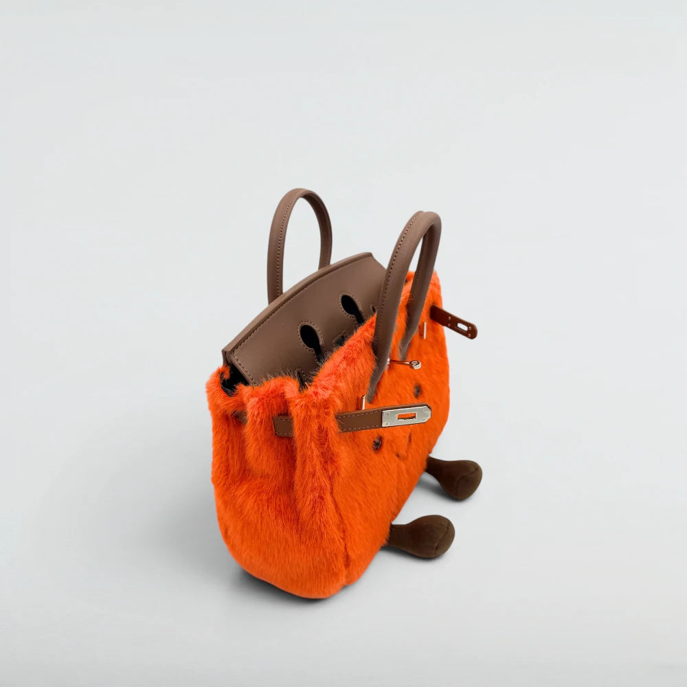 Top view of the open Bagulia Birky Orange faux fur bag showing silver hardware and interior