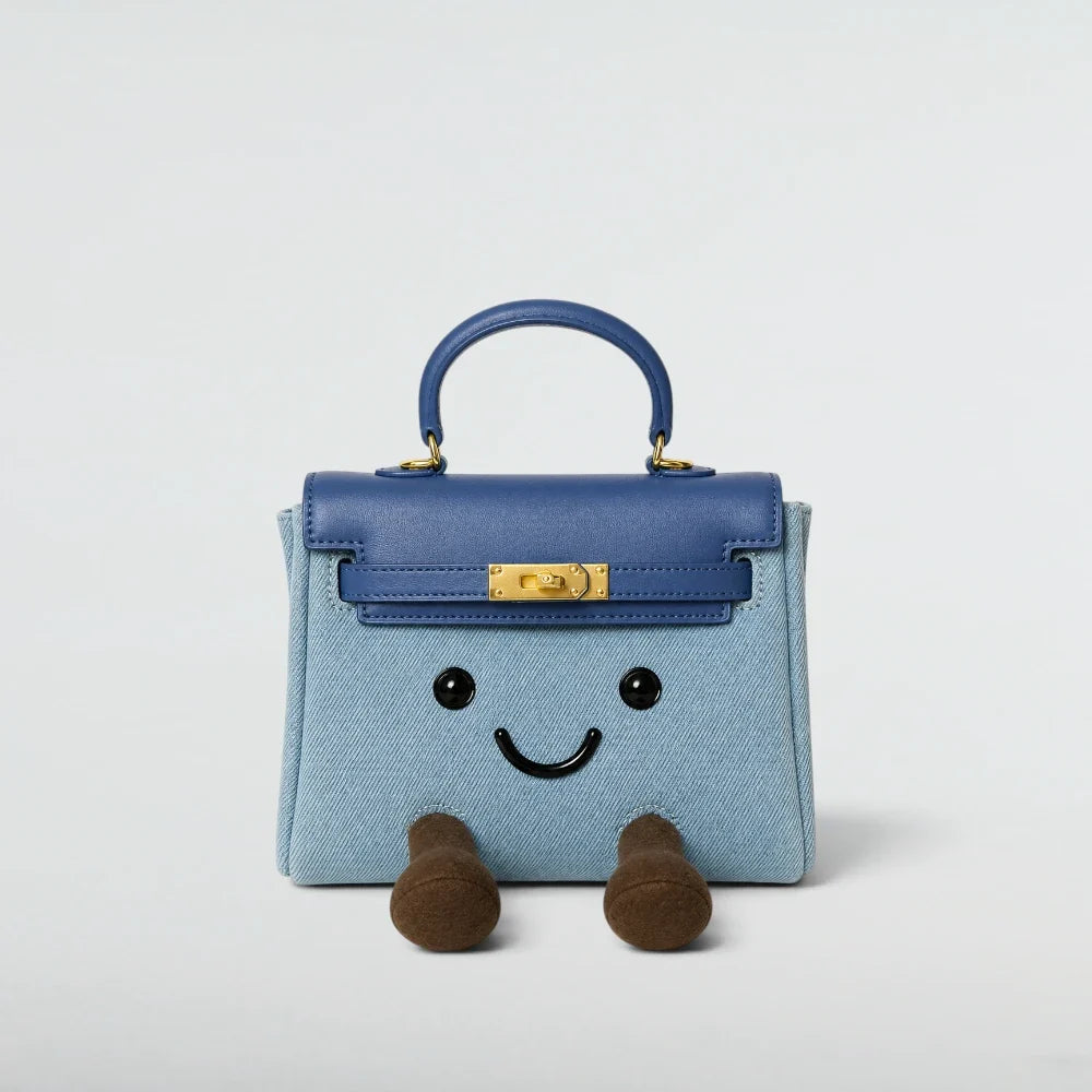 Bagulia Birky Jelly Kelly Denim Blue character handbag with gold-tone hardware front studio view