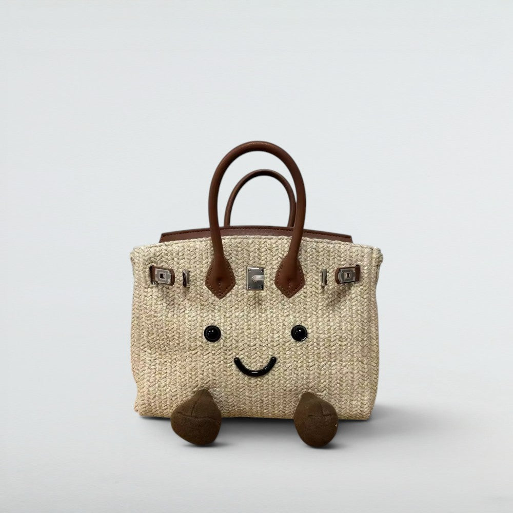 Bagulia Birky 25cm woven straw raffia summer bag with smiley face, beach lifestyle view
