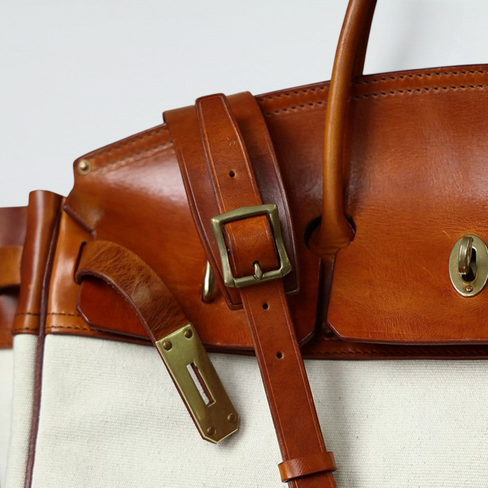 Bagulia Damascus travel bag, cream canvas, vegetable-tanned leather buckle and hardware detail