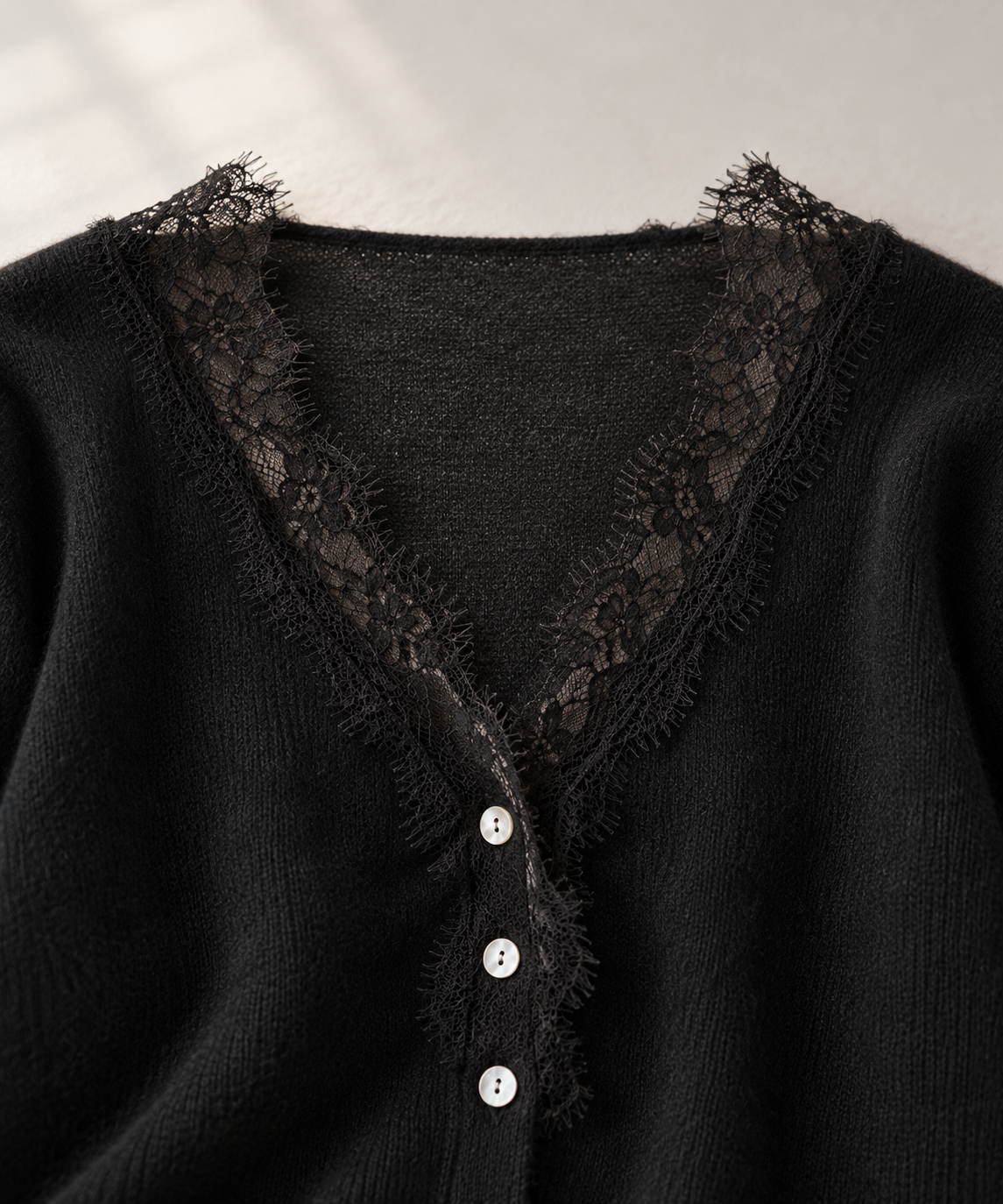 black lace-trim cardigan, neckline and knit detail