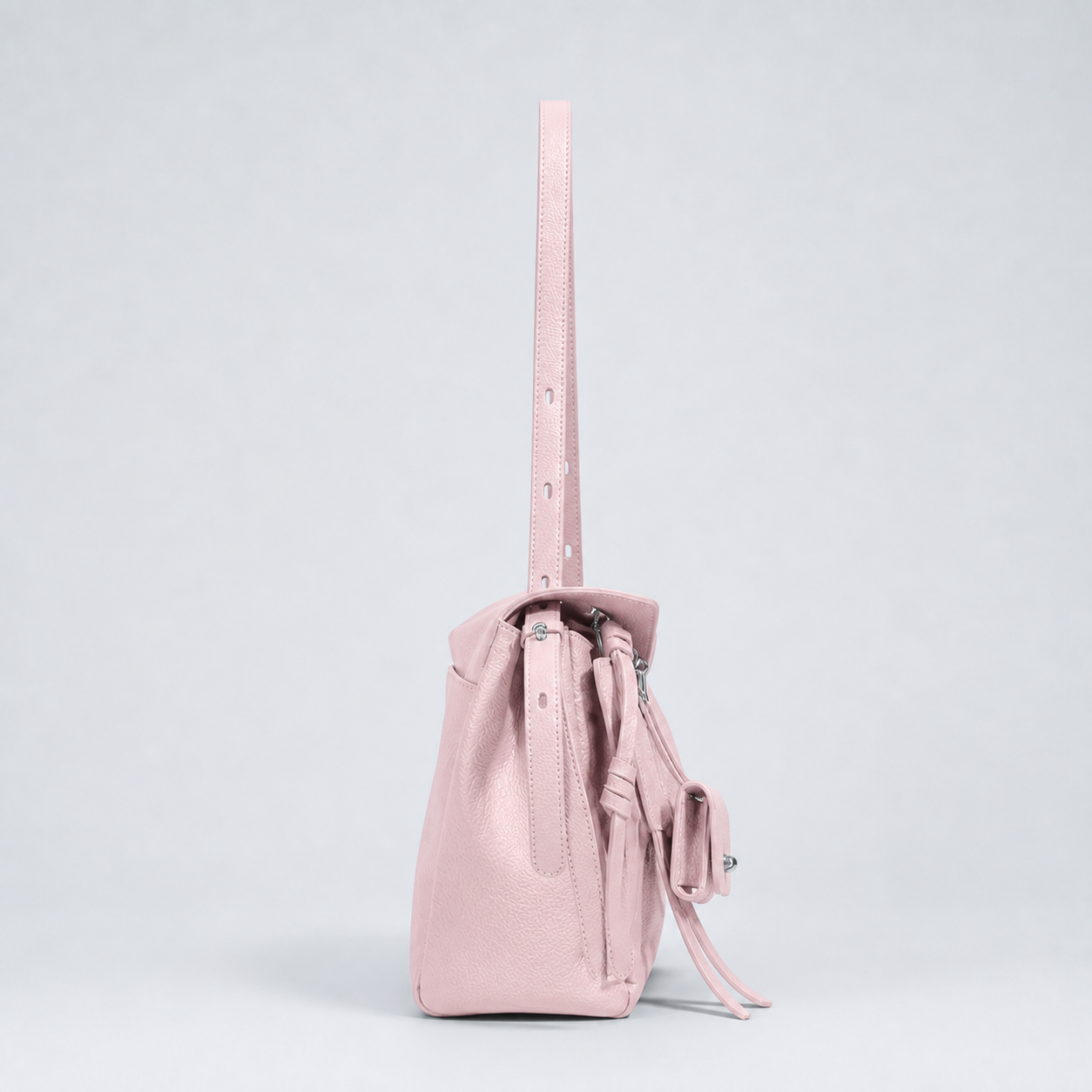 Leyla cream pink pebbled leather shoulder bag, side profile studio view
