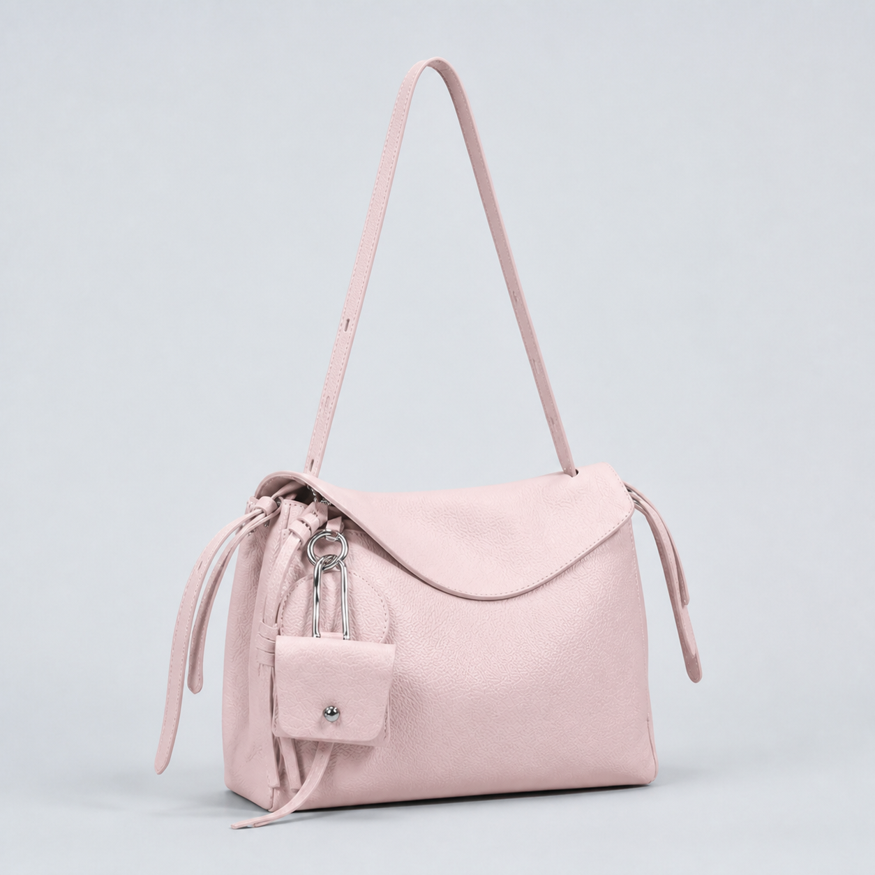 Leyla cream pink pebbled leather shoulder bag, three-quarter studio view