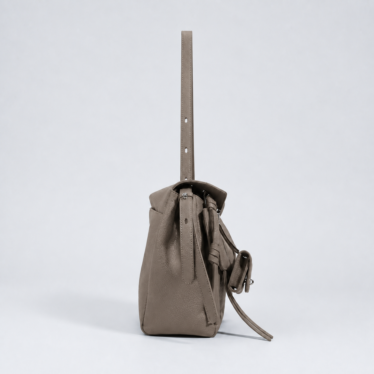 Leyla elephant grey pebbled leather shoulder bag, side profile studio view