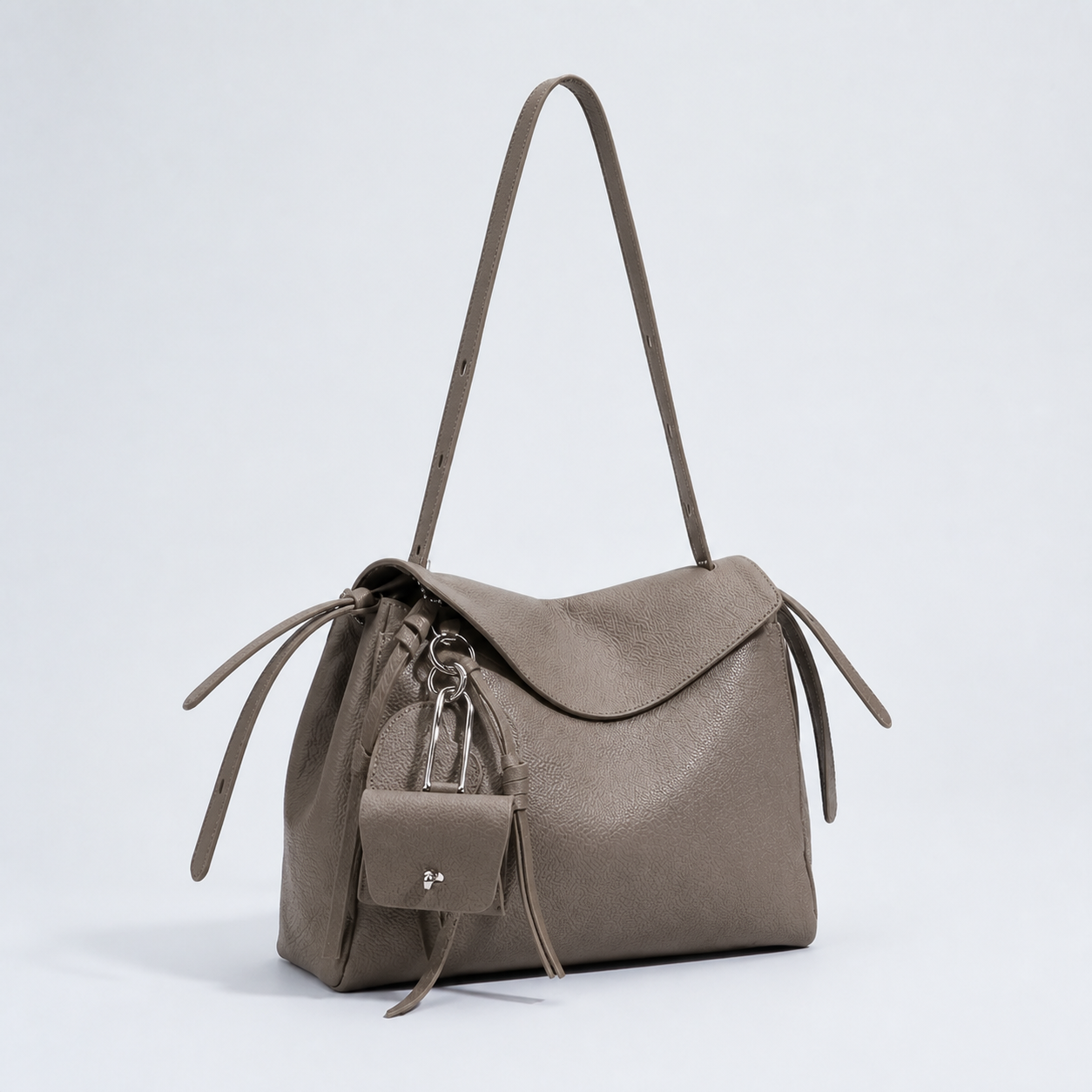 Leyla elephant grey pebbled leather shoulder bag, three-quarter studio view