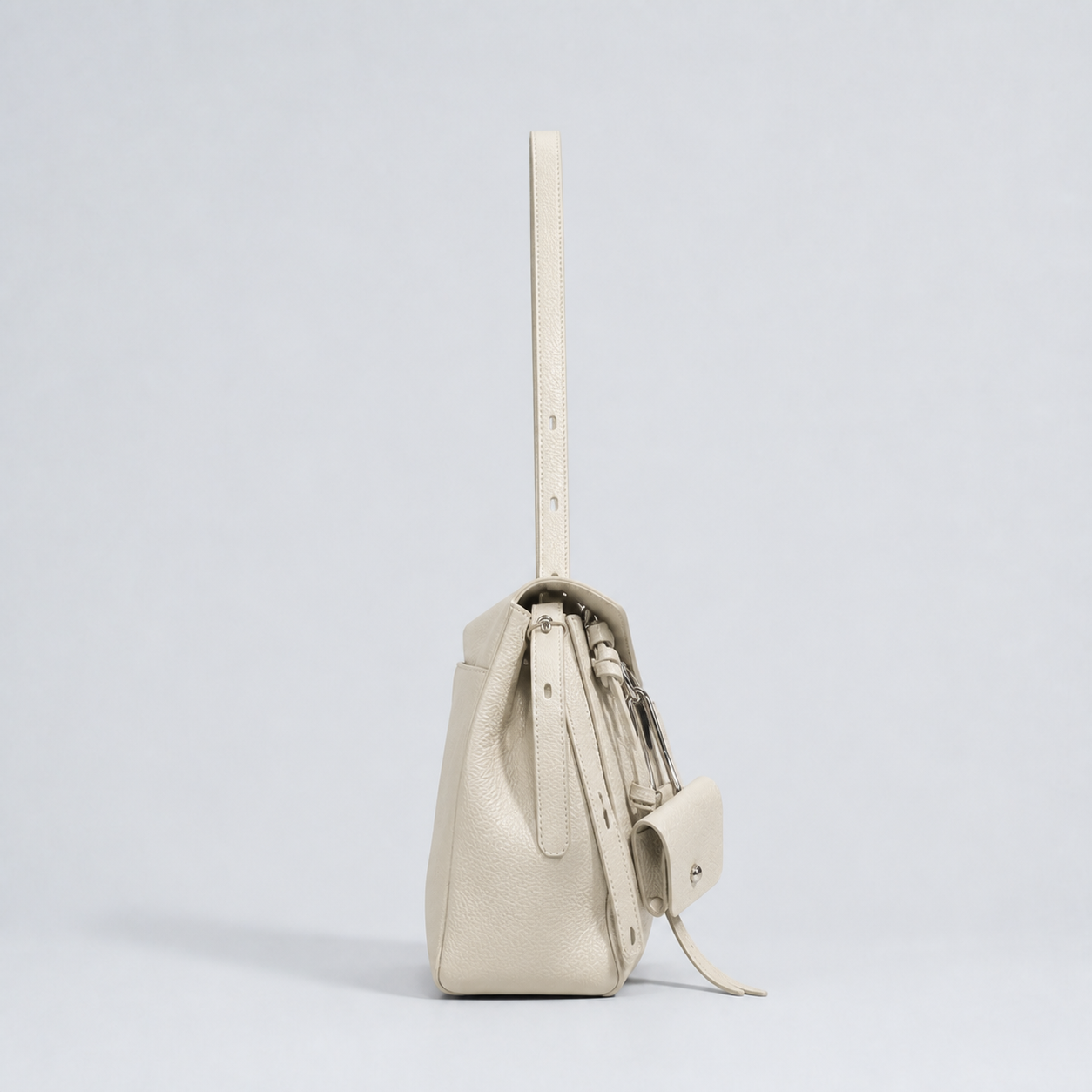 Leyla off-white pebbled leather shoulder bag, side profile studio view