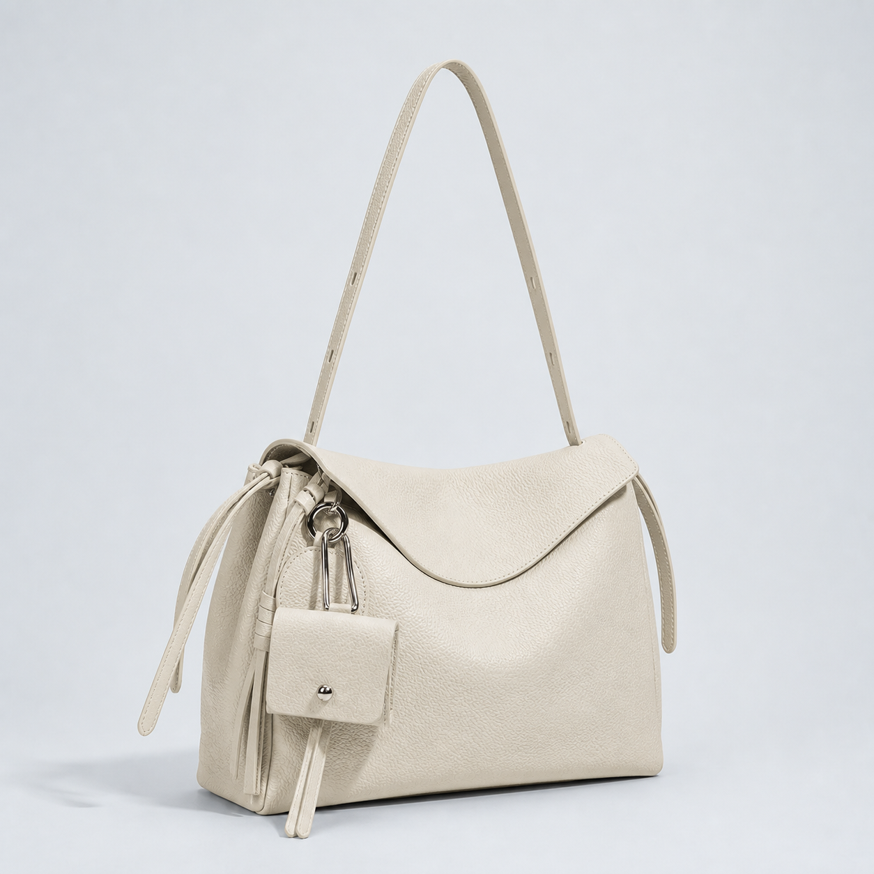 Leyla off-white pebbled leather shoulder bag, three-quarter studio view