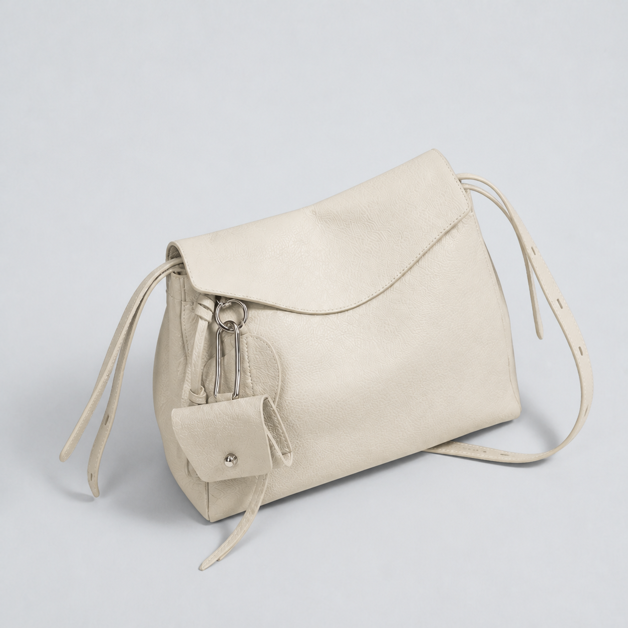 Leyla off-white pebbled leather shoulder bag, closed top-down studio view