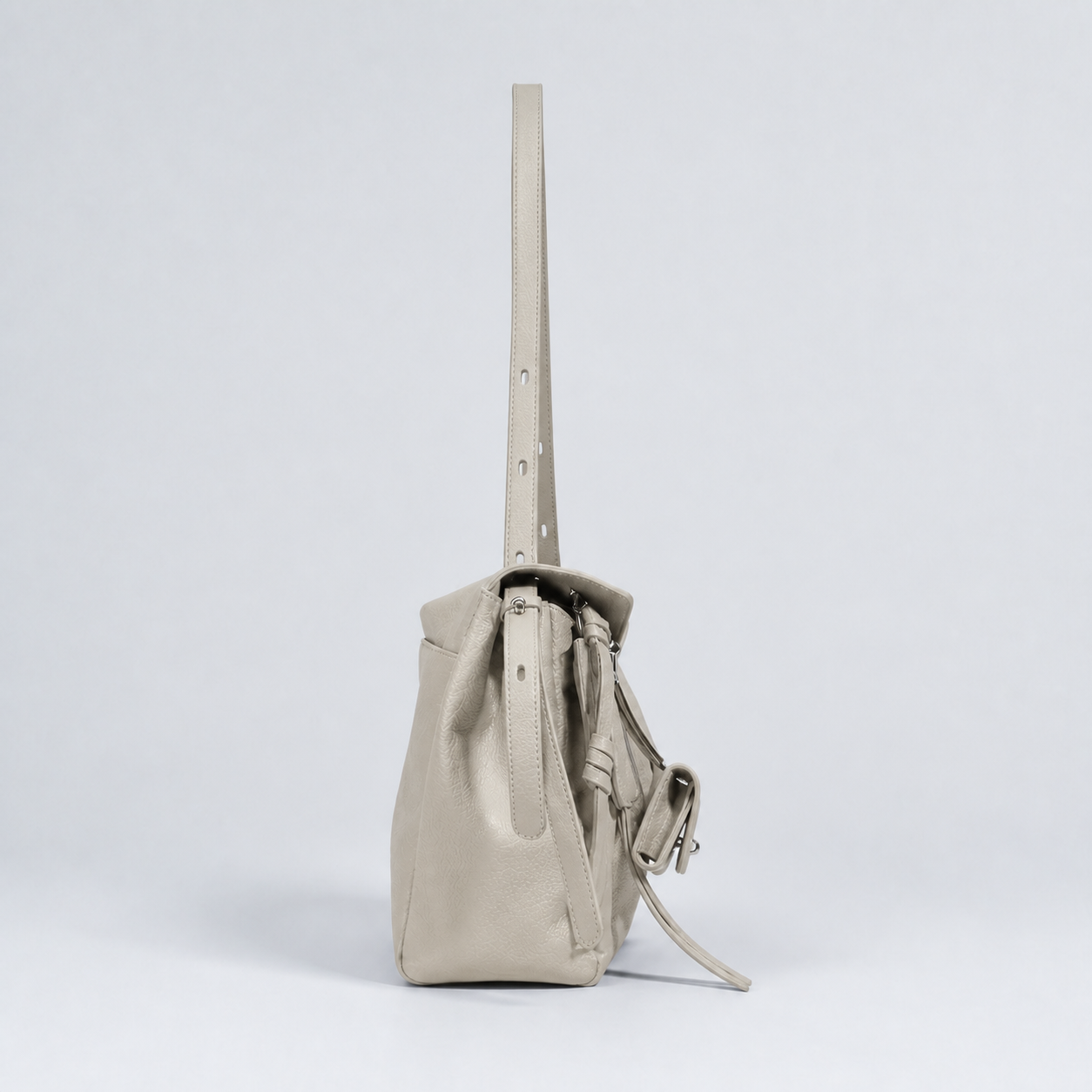Leyla pearl grey pebbled leather shoulder bag, side profile studio view
