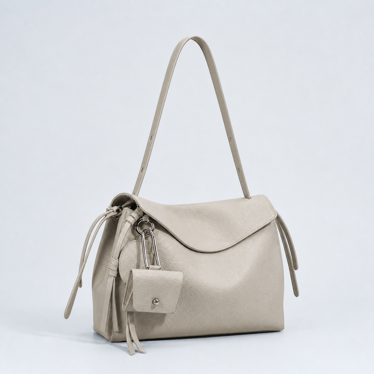 Leyla pearl grey pebbled leather shoulder bag, three-quarter studio view