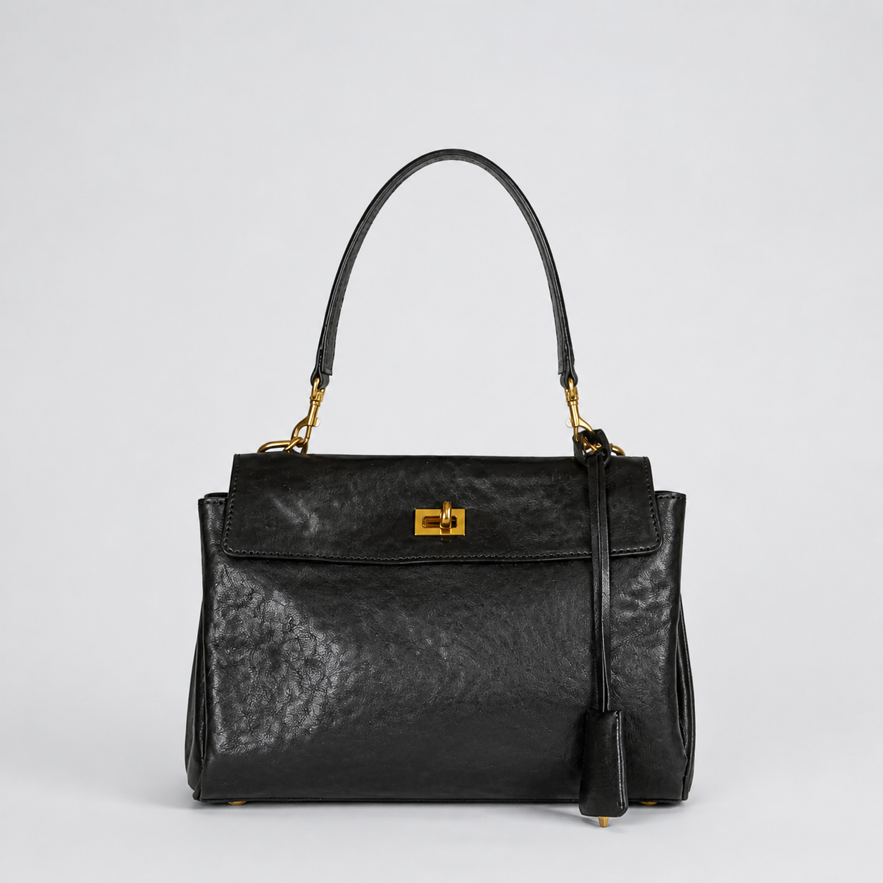 Bagulia Louve Locket Patina Bag in Black vegetable-tanned leather, front view