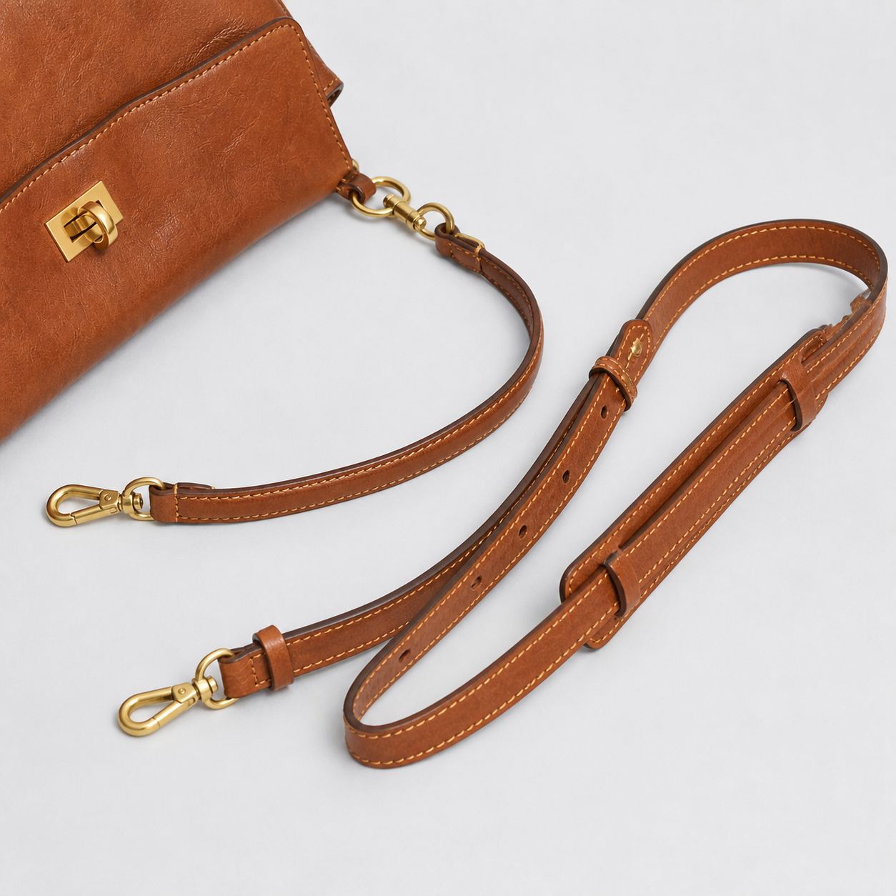 Bagulia Louve Locket Patina Bag in Cognac Brown with detachable short and adjustable long leather straps