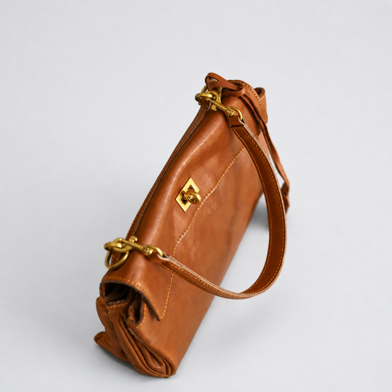 Bagulia Louve Locket Patina Bag in Cognac Brown vegetable-tanned leather, side view