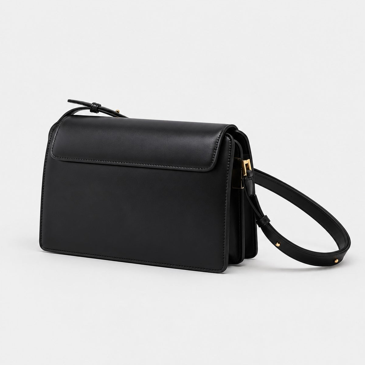 Bagulia Margot leather shoulder bag in black, back view.