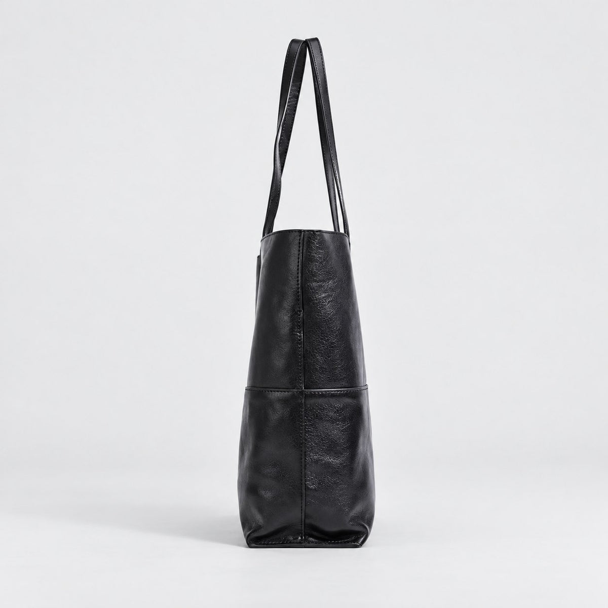 Bagulia Marielle Black tote side profile view.