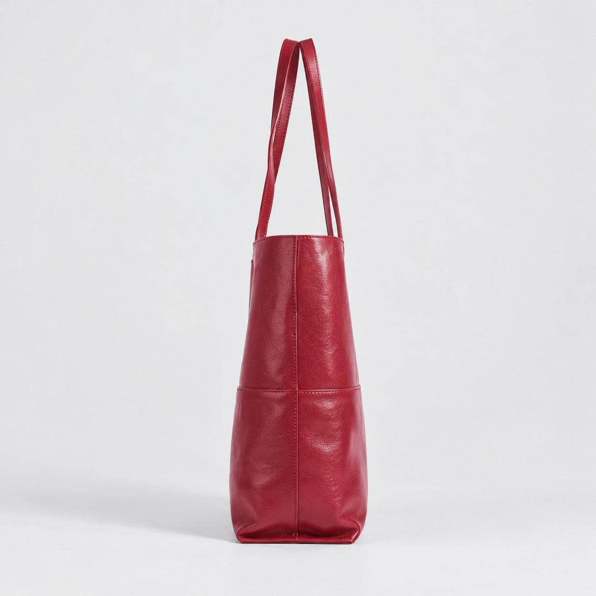 Bagulia Marielle Cherry Red tote side profile view.