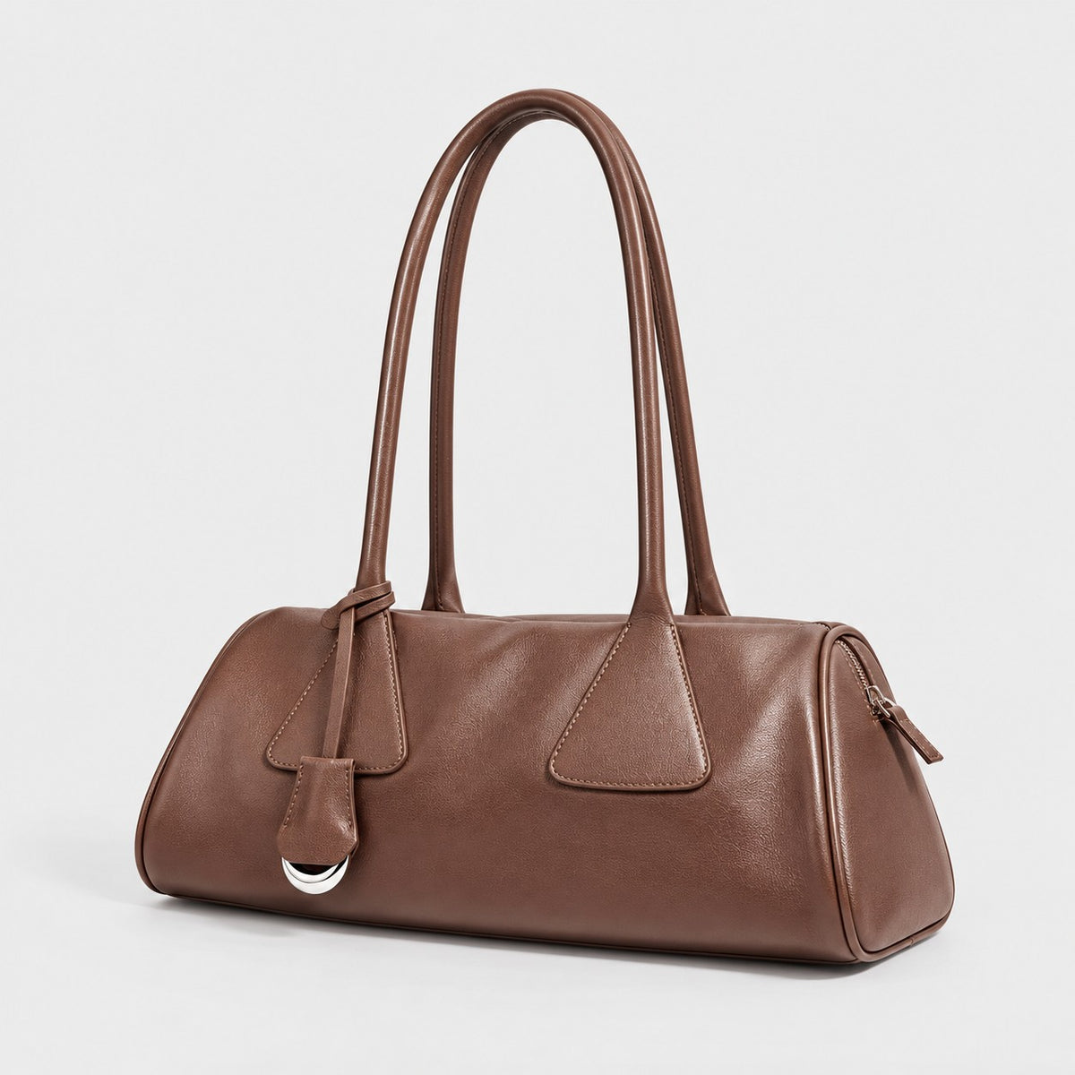 Bagulia Vera shoulder bag in brown shown in three quarter view.